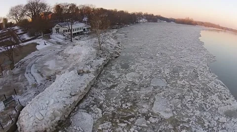 Flying over ice in River at Sunrise Stock-Footage 40320299