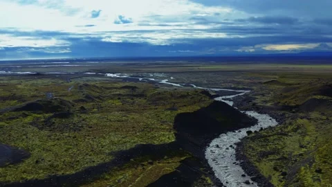 Flying over Iceland: river, rocks, slopes, hills, nature Stock Footage 168076997