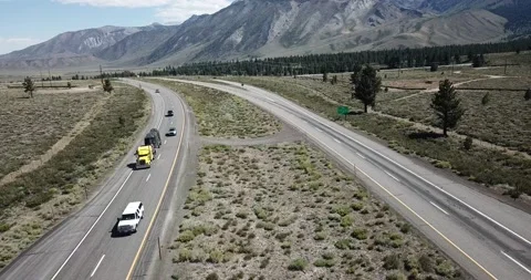 Flying Over the Interstate in Eastern Sierra Nevada Mountains Video stock 219581267