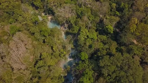 Flying over jungle forest and beautiful waterfall in Laos. Stock Footage 102265404