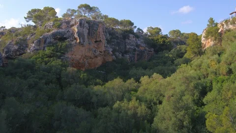 Flying over jungle orbiting a cliff with copper ore with INSPIRE 2 drone. Stock Footage 101425191