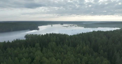 Flying over lake and forest in Finland Stock Footage 282902896