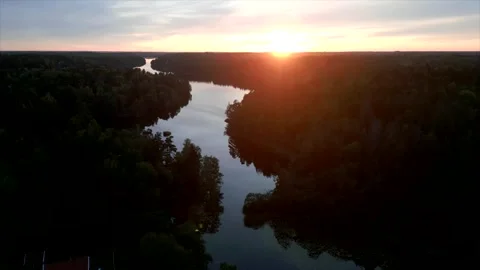 Flying over lake with backlight 4K Stock Footage 287884114