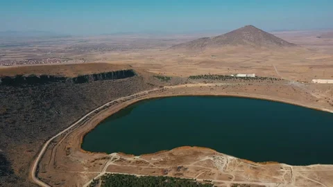 Flying over the lake in the middle of the sandy hills Stock Footage 169223937