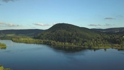 Flying over a lake to a mountain. Stock Footage 129310477