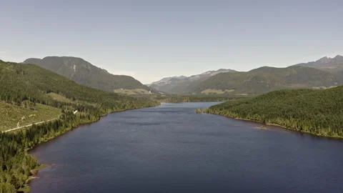 Flying over lake with road on the left Stock Footage 139503552