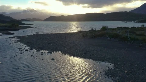 Flying Over a Lake at Sunset in Chile Tilting Upwards Stock Footage 100641671
