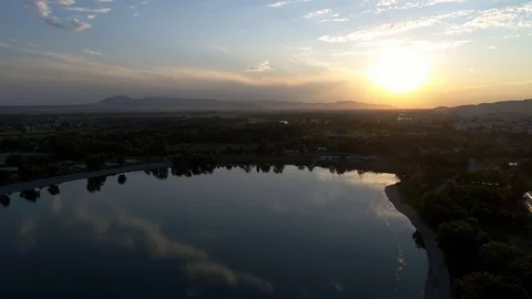 Flying over a lake at sunset Stock Footage 95196523