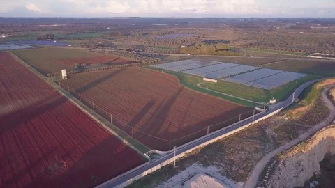 Flying over the lands with a drone at sunset Stock-Footage 85114160