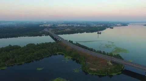 Flying over the large bridge across the river Stock-Footage 67285851