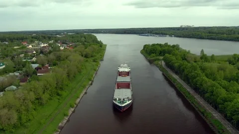 Flying over a large cargo ship with open holds sailing down Stock Footage 131628397