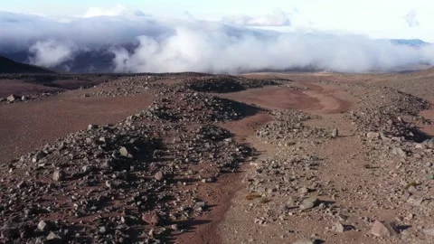 Flying over a large plain with brown and red colors full of sharp rocks Stock Footage 142756684