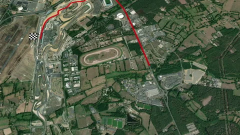 Flying over Le Mans racing circuit map red marking line on track Video stock 155243248
