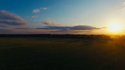 Flying over the lield at Sunset Stock Footage 74415266