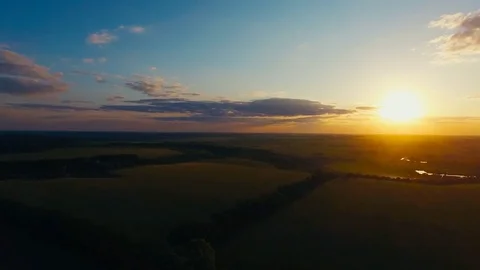 Flying over the lield at Sunset Stock Footage 74430052