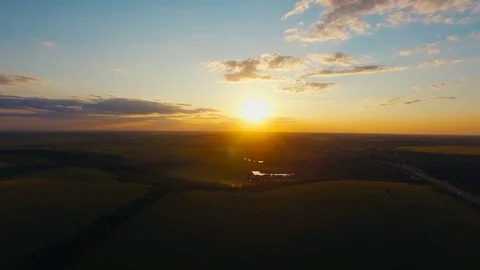 Flying over the lield at Sunset Stock Footage 74433623