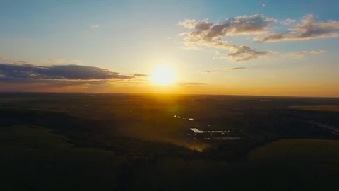Flying over the lield at Sunset Stock Footage 74445843