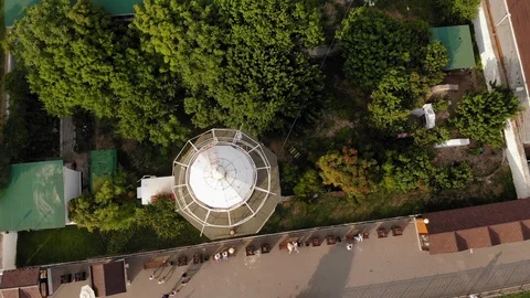 Flying over the lighthouse on a cliff of the coast near the sea. Aerial shot Stock-Footage 116168576