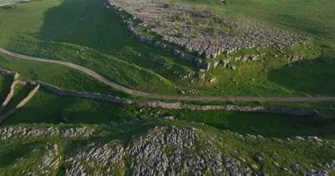 Flying over limestone pavement in Yorkshire Dales Stock Footage 277364434