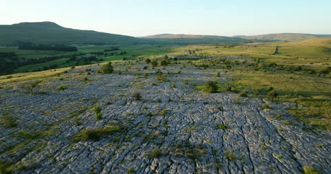 Flying over limestone pavement in Yorkshire Dales Stock Footage 313861053