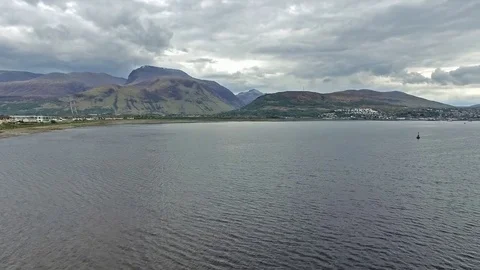 Flying over the Loch Linnhe in Fort William towards Ben Nevis Stock Footage