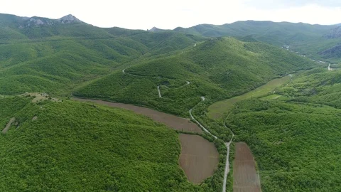 Flying over a Long Mountain Road Among Hills, Lakes and Vineyards. Crimea. Stock Footage 126267841