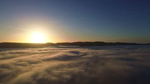 Flying over Low Hanging Clouds at Sunset 4k Drone Stock Footage 294097805