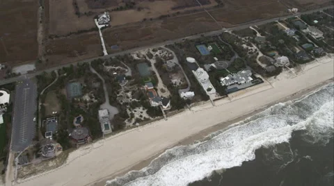Flying over luxurious beachfront homes west of Shinnecock County Park, Long Stock Footage 59173276