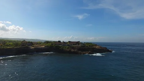 Flying over luxury villa with pool on the cliff Stock Footage 111780104
