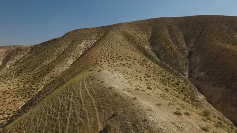 Flying over man climbing up from valley of Wadi Qelt. Israel. DJI-0196-06 스톡 동영상 124448443