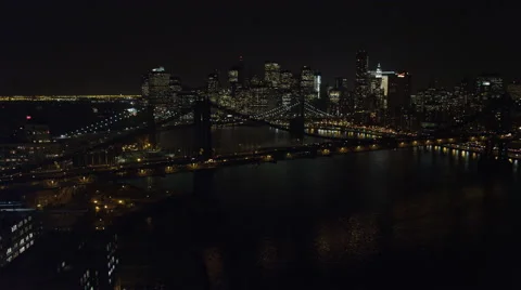 Flying over Manhattan Bridge toward Brooklyn Bridge at night. Shot in 2011. Stock Footage 59171873