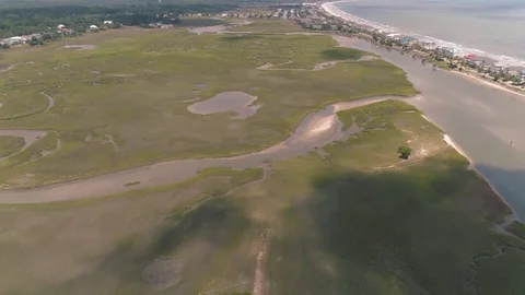 Flying over the Marsh and Ocean Stock-Footage 79099444