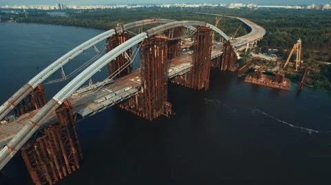 Flying Over Massive Bridge in Under Construction Stock Footage 68639141