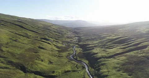 Flying over a meandering river Stock Footage 143292497