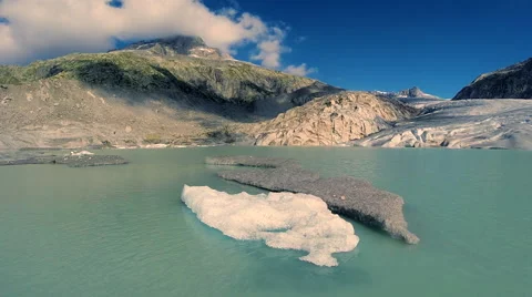 Flying over melting ice floe swimming in glacier lake. climate change background Video stock 42246540