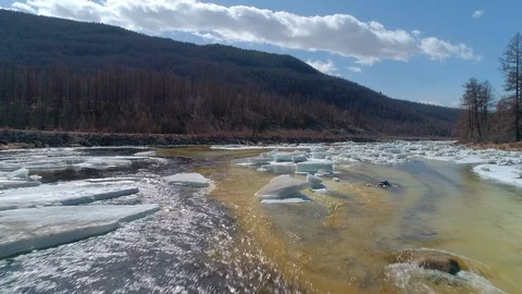 Flying over a melting river ice cover in spring. Stock Footage 100009917