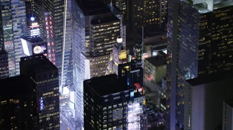 Flying over Midtown Manhattan at night, looking back at Times Square. Shot in Stock Footage 59172430