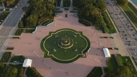 Flying Over Millennium Park Tilting Up Towards The City Skyline Stock Footage 100588777