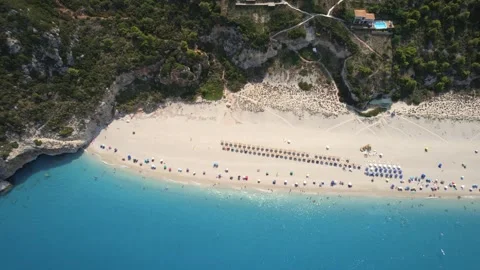 Flying over Milos beach, Lefkada, during the summer, Greek Ionian Islands. Stock Footage 257039195