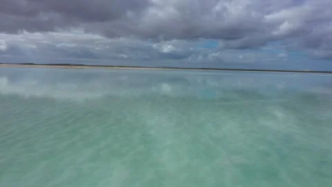 Flying over mirror surface of saline pond Vídeo Stock 261267133