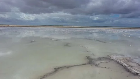 Flying over mirror surface of saline pond Vídeo Stock 262050480
