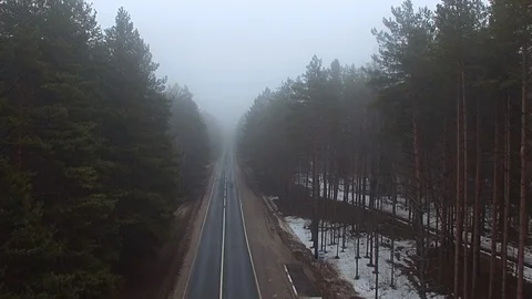Flying over the misty forest along the road, quadcopter,, drone ,spring, morning Stock Footage 107741682