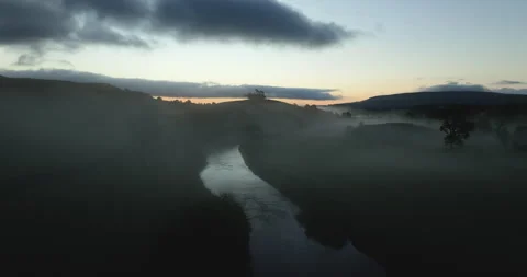 Flying over misty valley Stock Footage 321648762