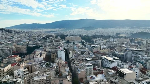 Flying over the modern town of Athens, Greece with the Greek parliament in the Stock-Footage 327767193