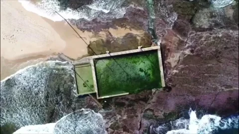 Flying over Mona Vale Beach Rock Pool Stock Footage 112468365