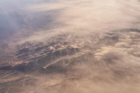 Flying over Mongolia - mountain view among clouds and fog, mountain landscape Stock Photos