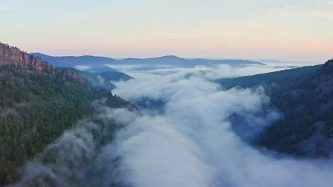Flying over morning haze in a valley Видео 263953053