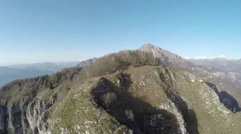 Flying over mountain. Aerial view of mountain peaks Video stock 44322433