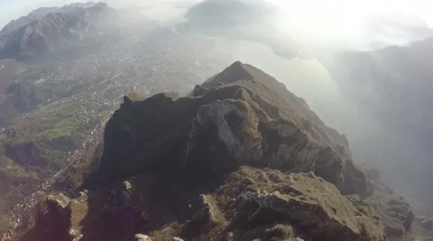 Flying over mountain. Aerial view of mountain peaks with lakes Video stock 44322928