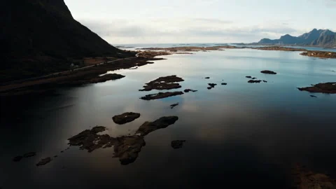 Flying over a mountain cliff in the ocean Stock Footage 297123020